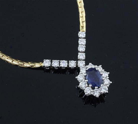 An 18ct two colour gold, sapphire and diamond cluster pendant necklace, 42cm.